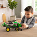 boy playing with the John Deere 1:32 412R Sprayer