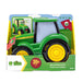 John Deere Lights N Sound Johnny Tractor in retail packaging, featuring a green body with yellow wheels and a light-up window, shown on a white background.