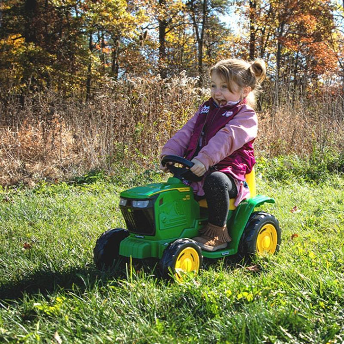 someone enjoying a John Deere Mini Tractor