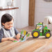 child reading the John Deere Tractor Tales Book